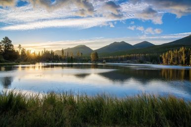 A peaceful landscape at sunrise symbolising serenity.